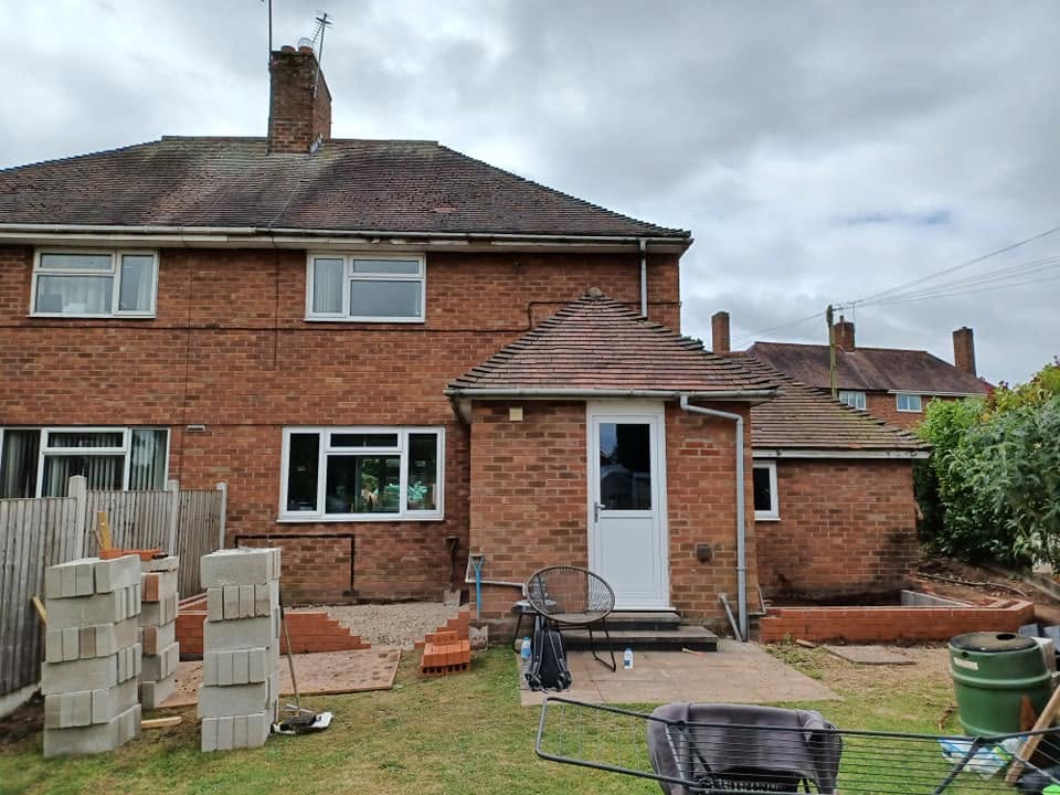 Rear of semi-detached house with brick porch before extension, Eccleshall