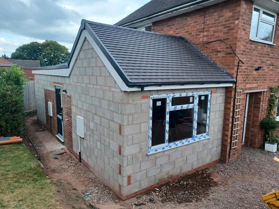 Side extension in blockwork with tiled roof and new window, Eccleshall