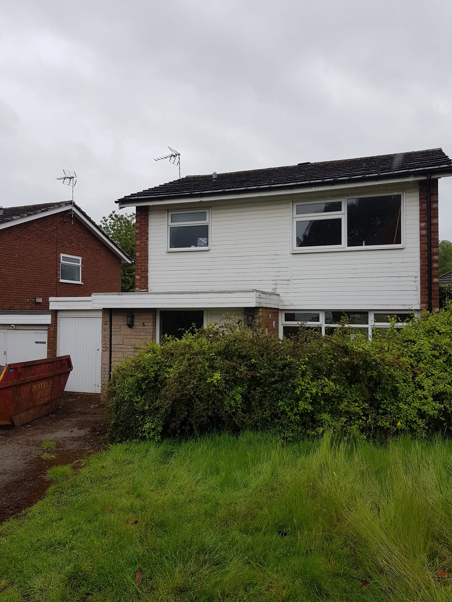 Tired 1970s house with old garage before facelift, Lichfield